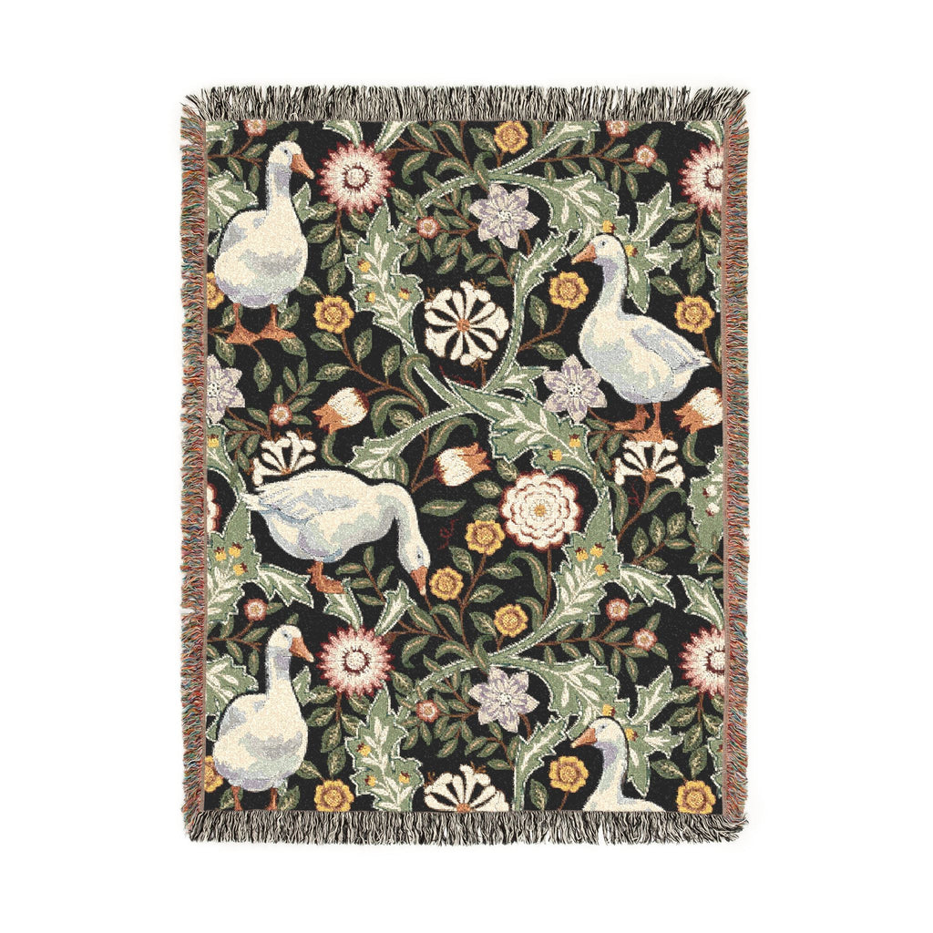 Decorative blanket with floral and geese pattern on a white background