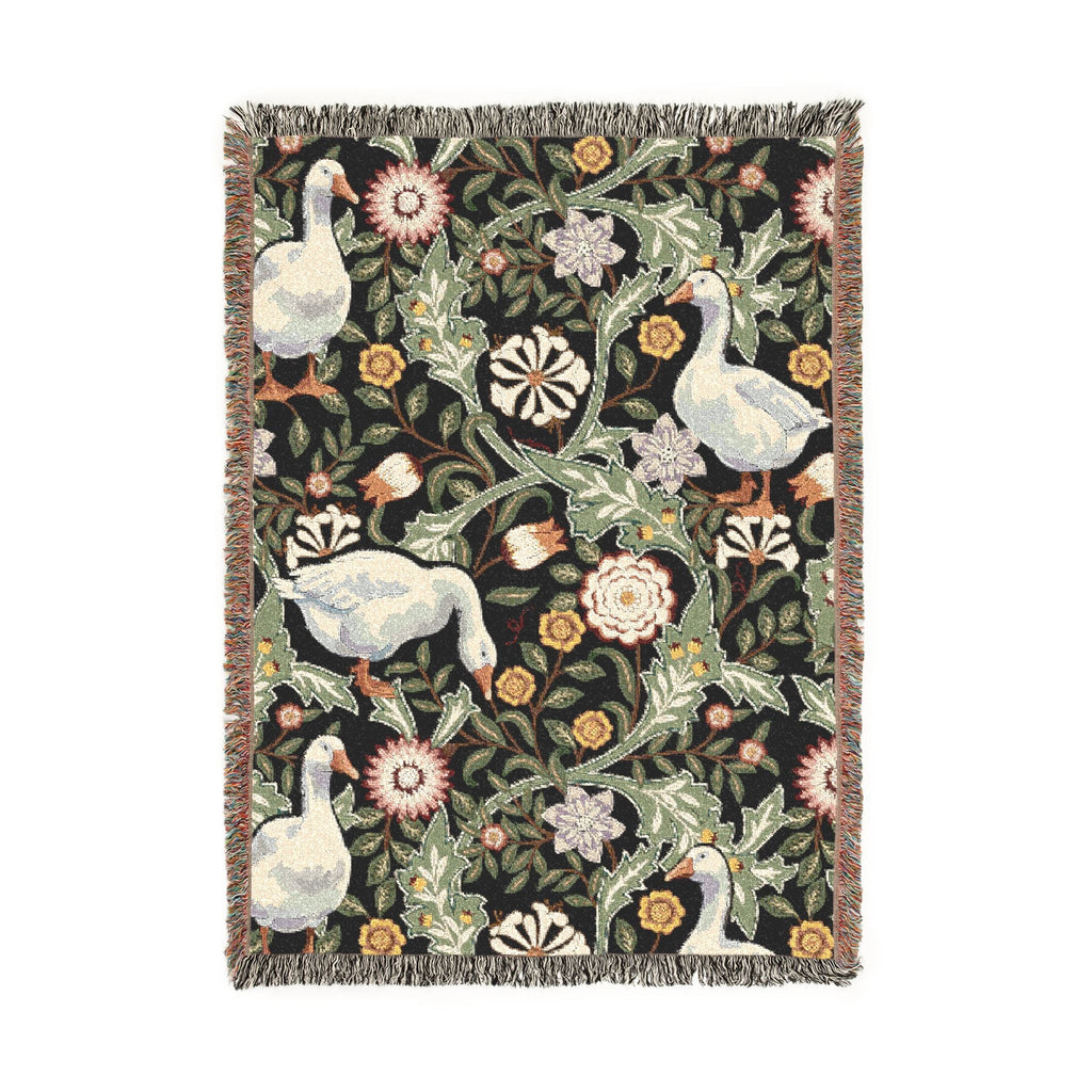 Decorative throw blanket with floral and goose pattern on a black background