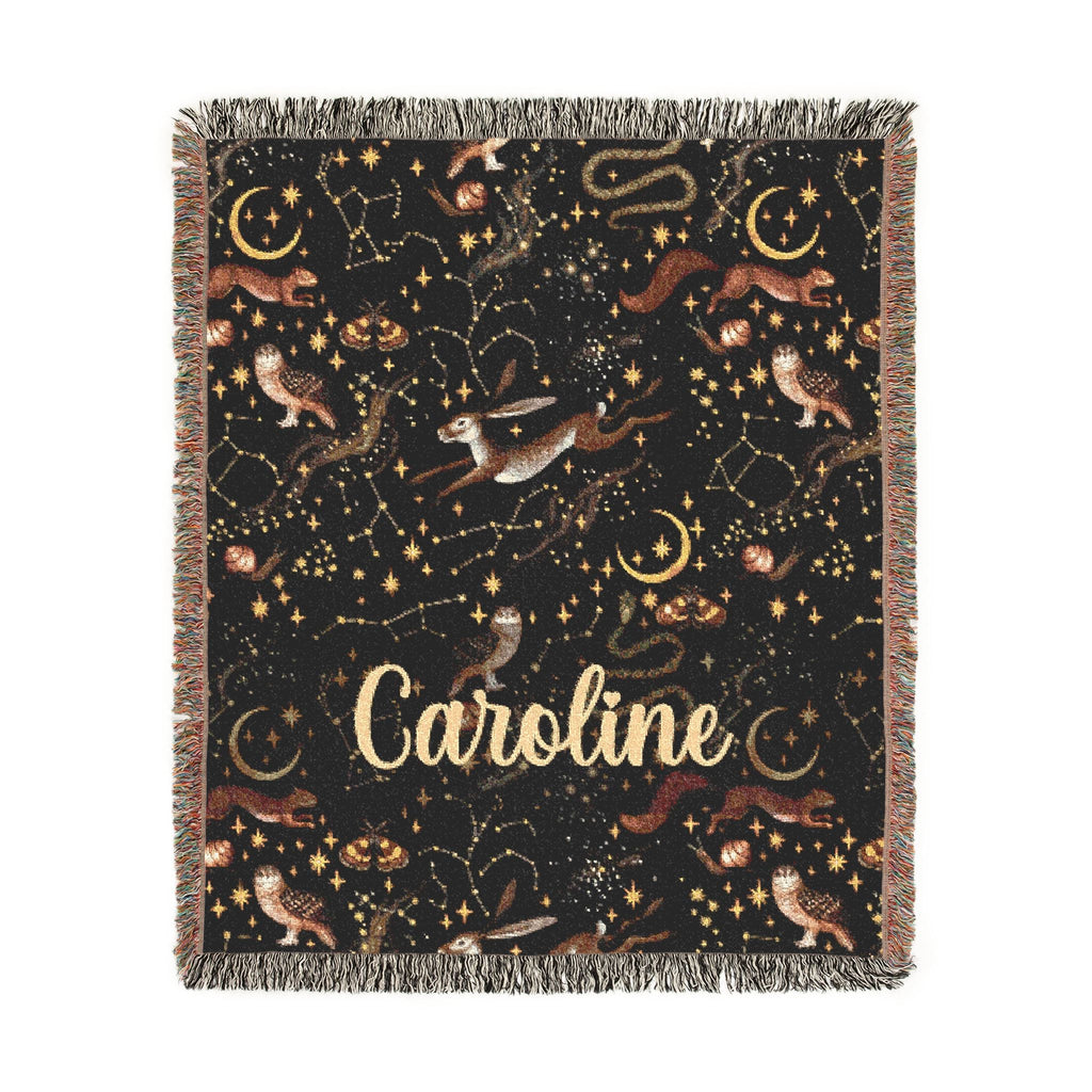 Blanket with star constellations and the name 'Caroline' on a black background