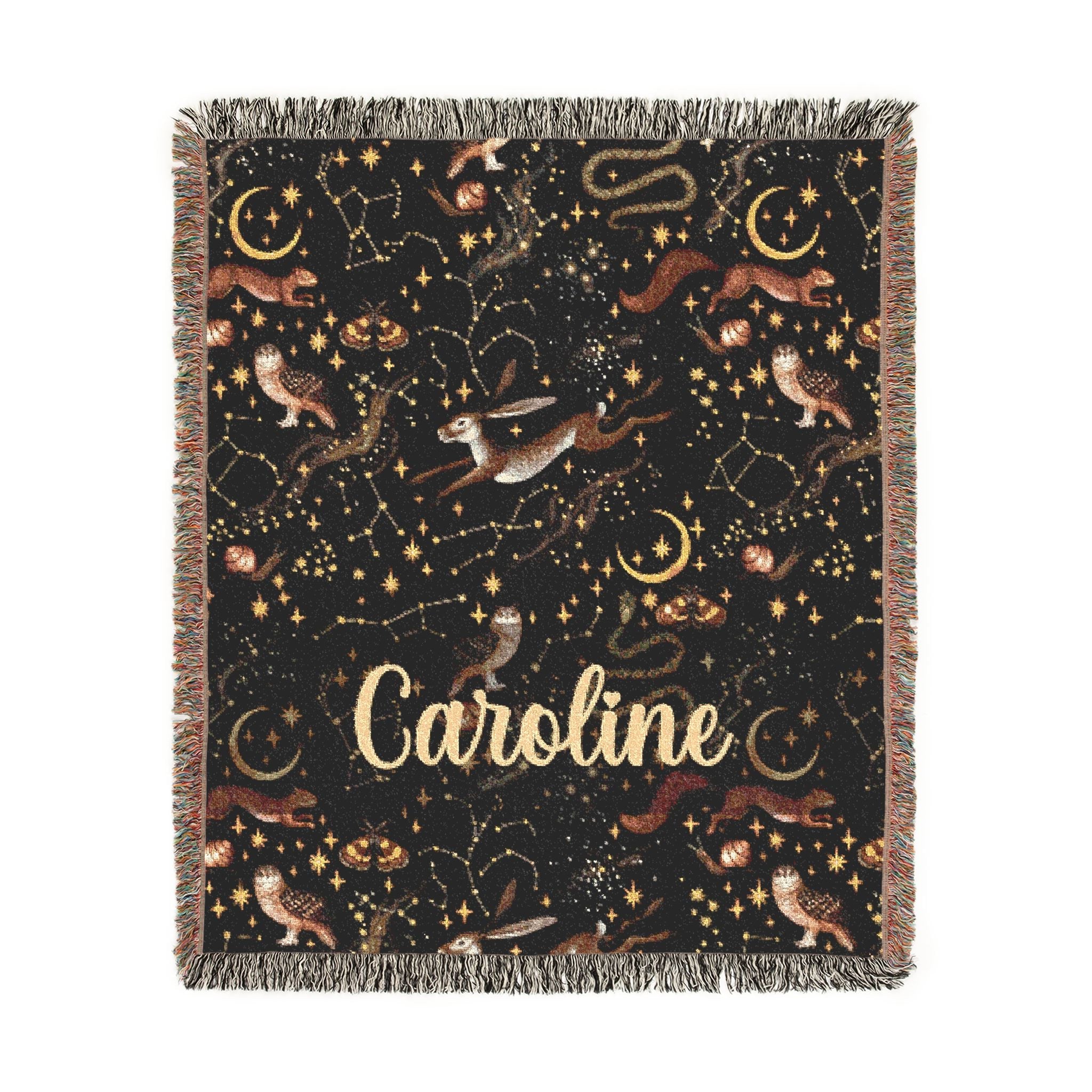 Blanket with star constellations and the name 'Caroline' on a black background
