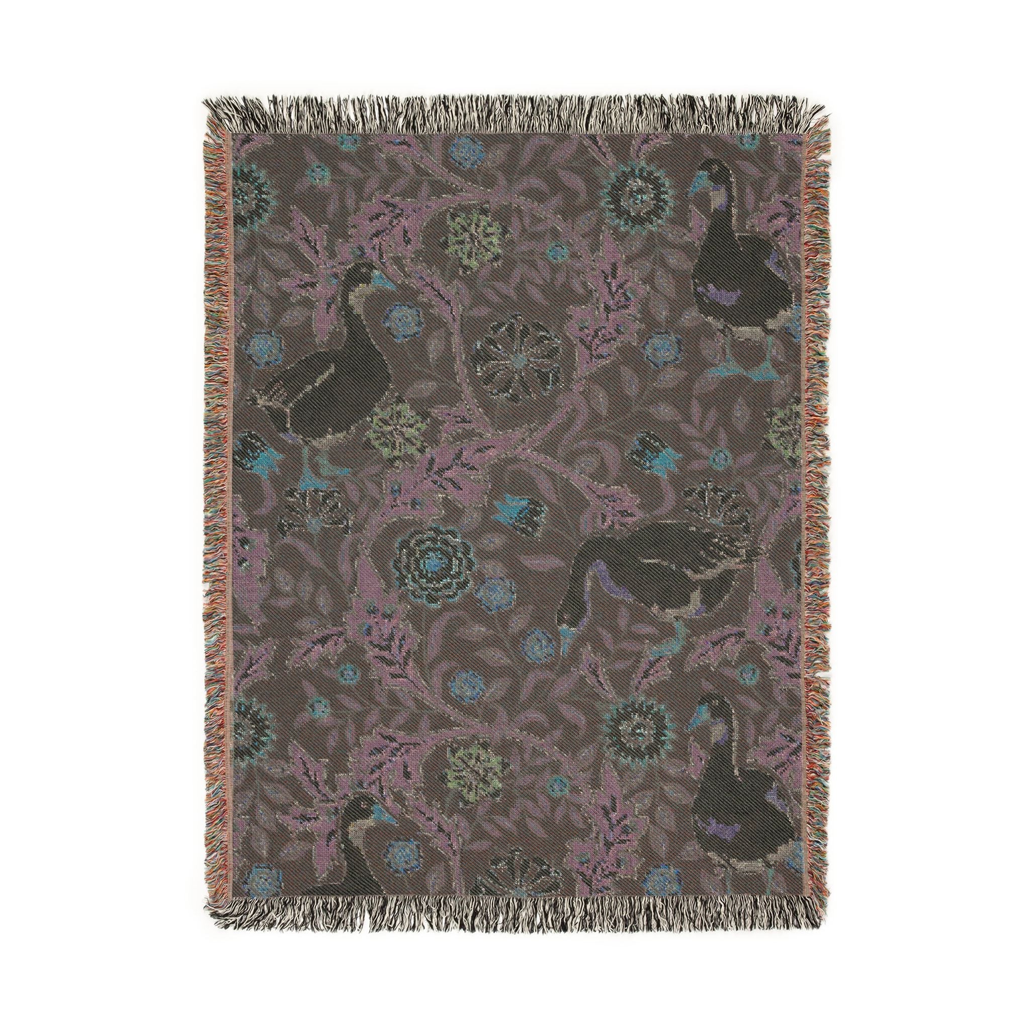 Decorative throw blanket with animal and floral pattern on a plain background
