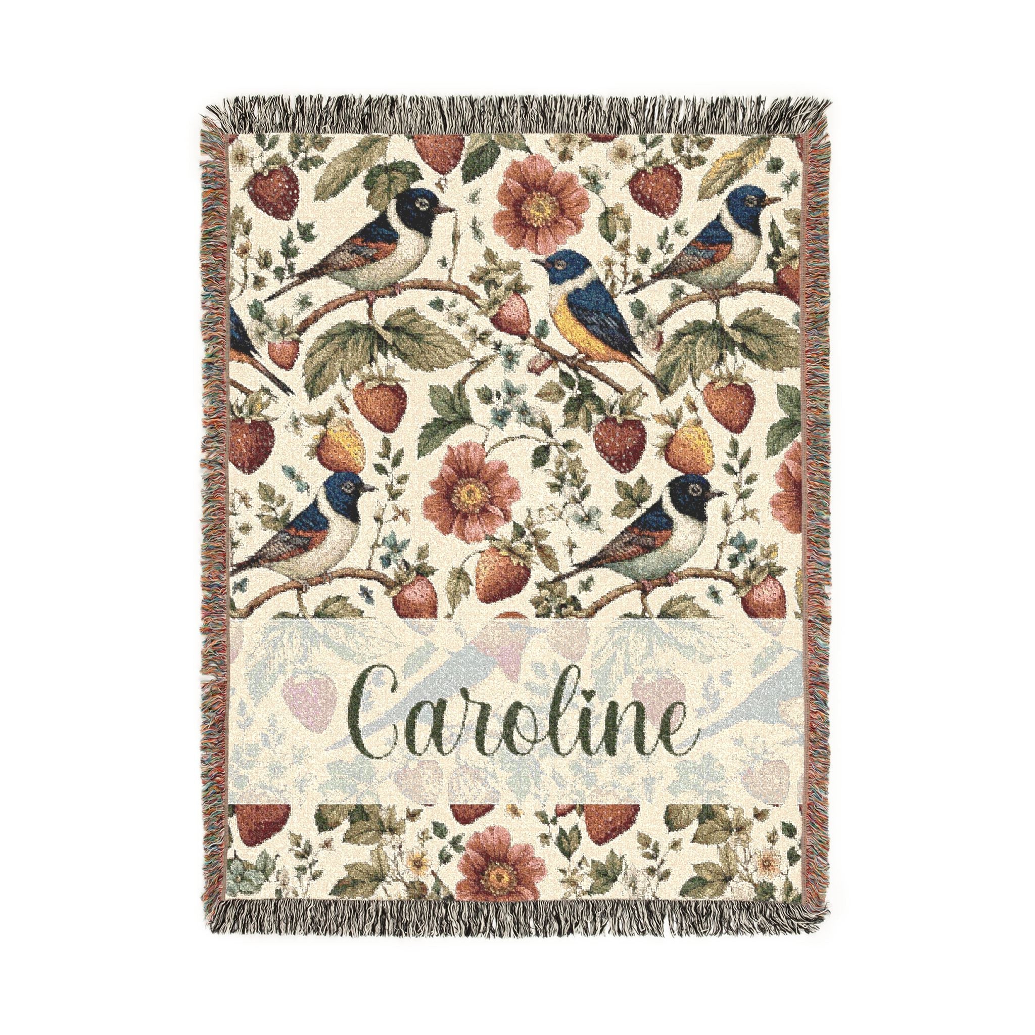 Decorative blanket with floral and bird pattern on a white background