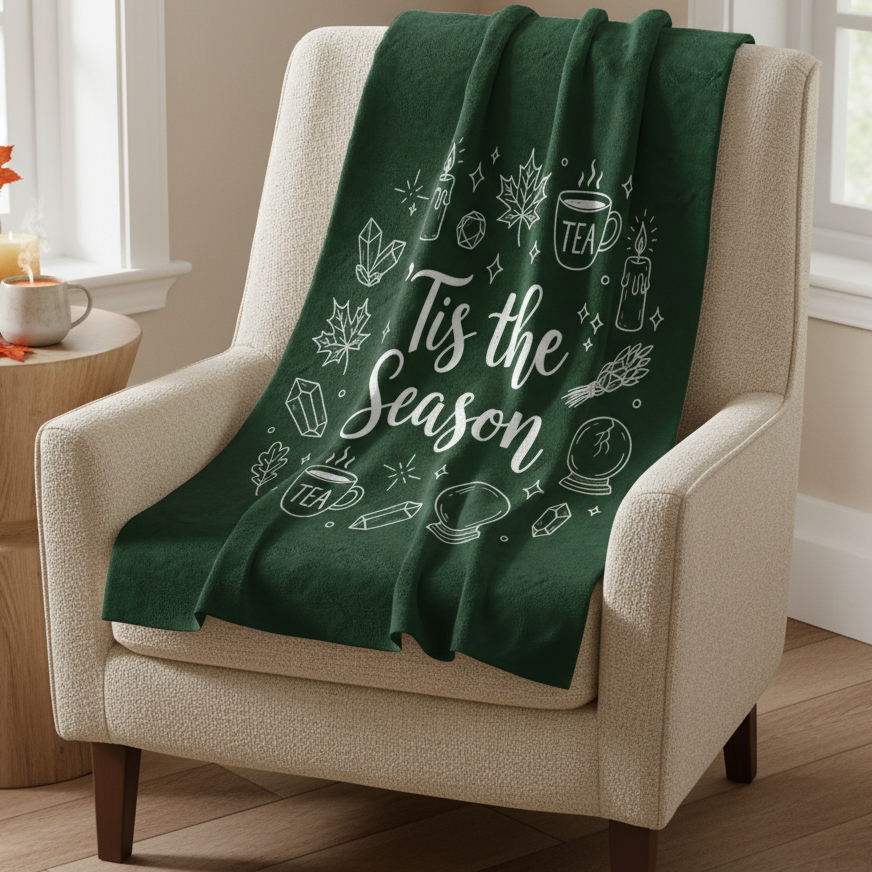 Green blanket with white text and graphics on a white background