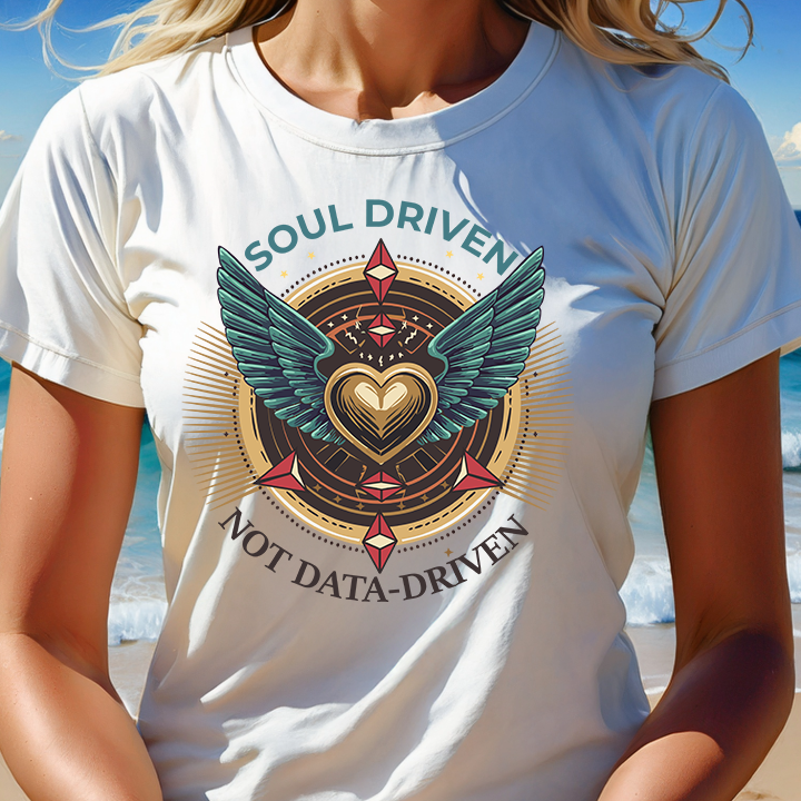 Person wearing a white t-shirt with a motivational design on a beach