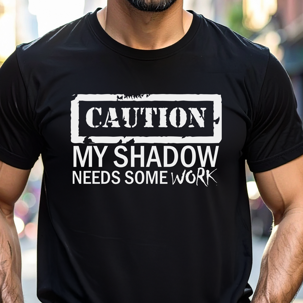 Person wearing a black t-shirt with humorous text design.